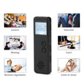Black matte-finish MP3 digital voice recorder on a table showing its screen, recording button, and compact size.