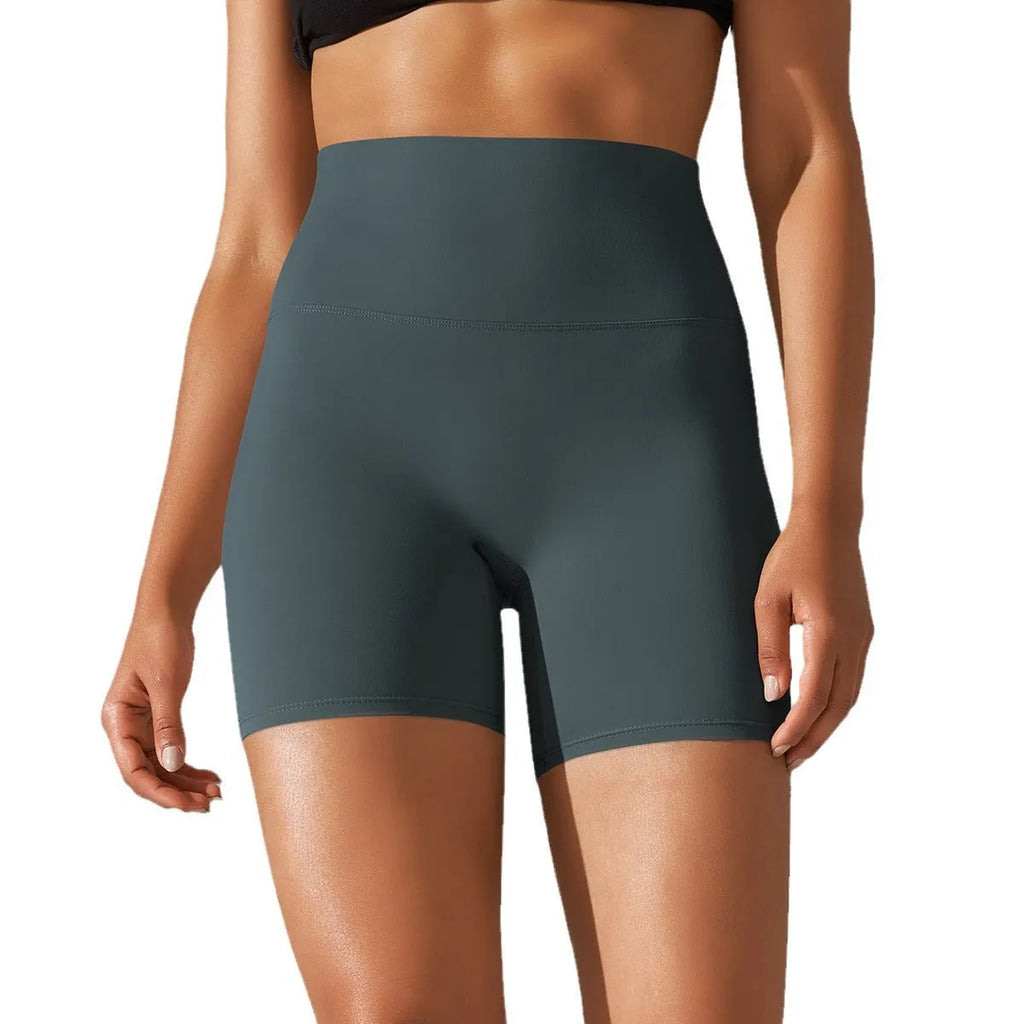 Women's high waist fitness pants in dark green with belly contracting design for sports and daily wear