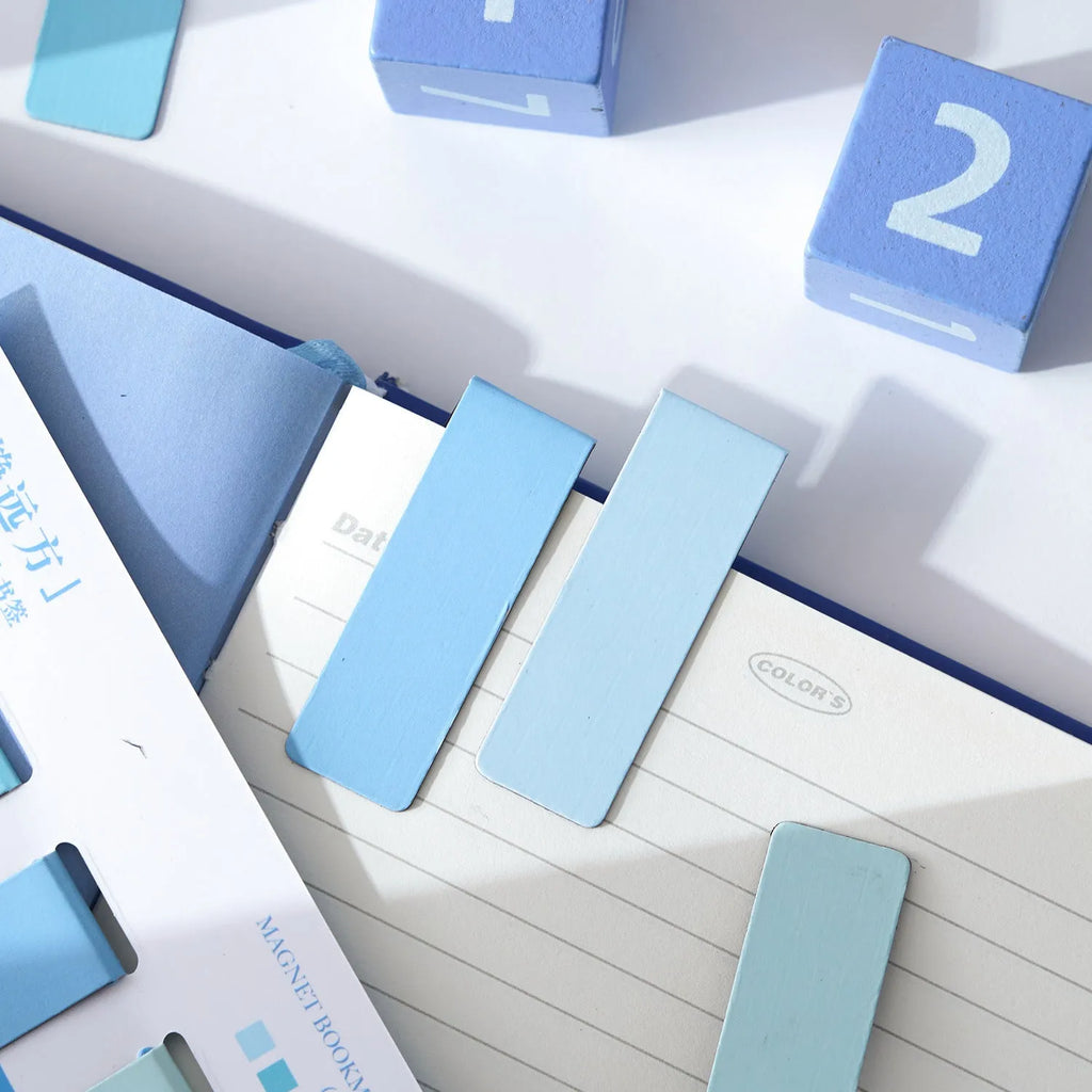 Set of four small magnetic bookmarks showing Morandi colour blocks in soft green, grey, pink, and blue tones.