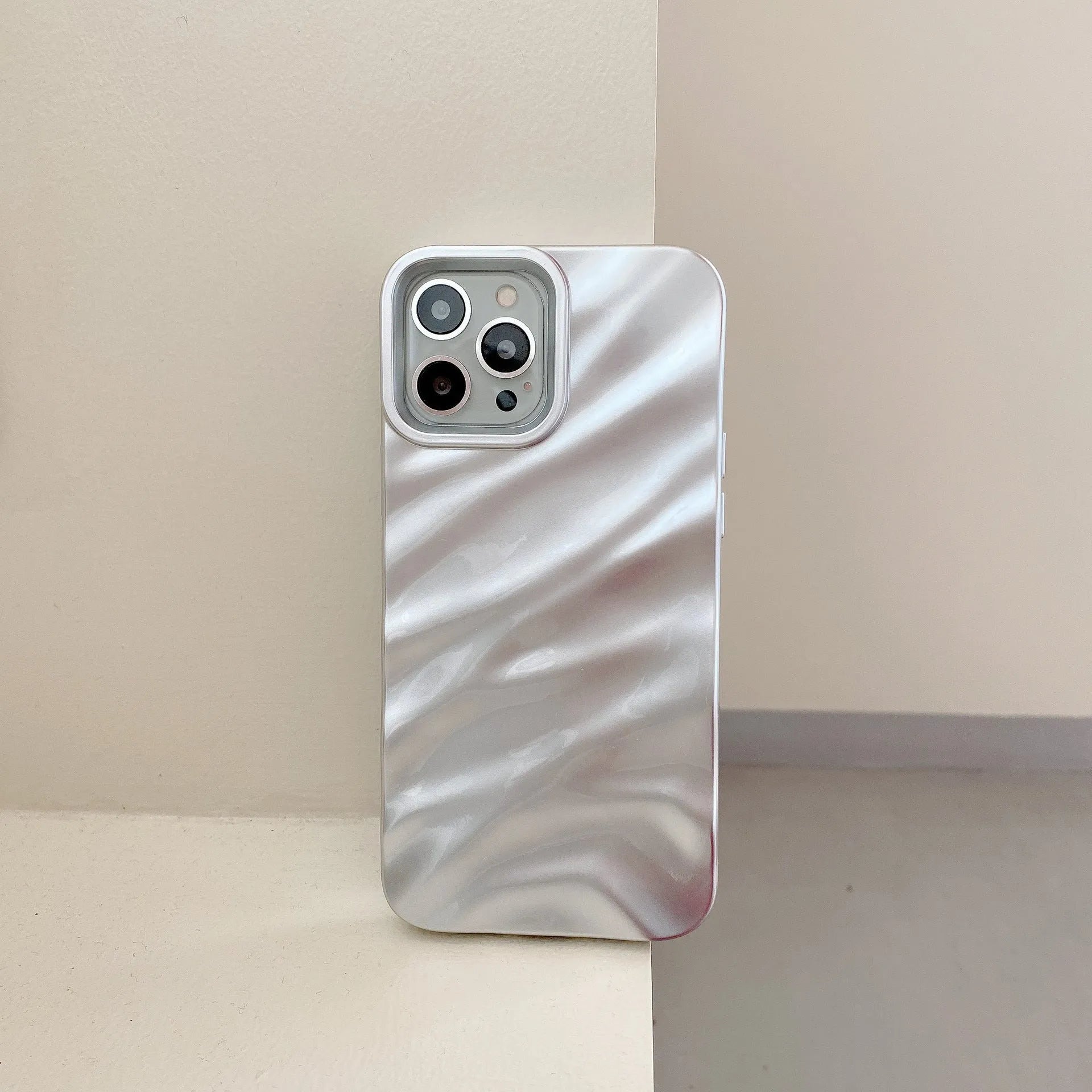 Soft wave pleated TPU phone case for Apple iPhone 17 in a selection of colours including electroplated gold and matte purple.