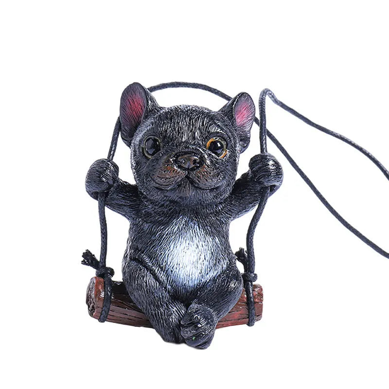 Small resin bulldog cartoon pendant for hanging on a car rearview mirror.