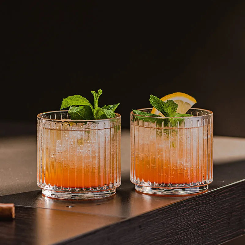 Clear glass whiskey wine glass with striped pattern on modern bar table