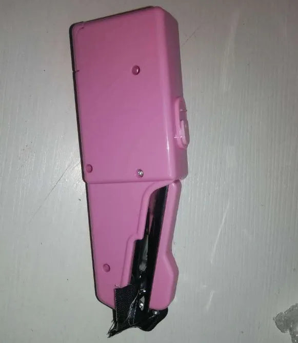 Handheld mini sewing machine set with thread spools, scissors, ruler, and clips in multiple colours