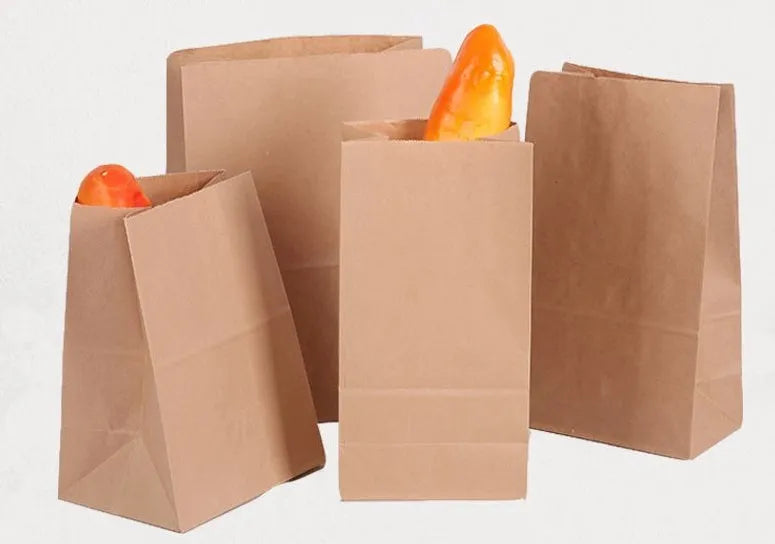 Yellow thickened kraft paper inner packaging bag with aluminium foil lining for snacks.