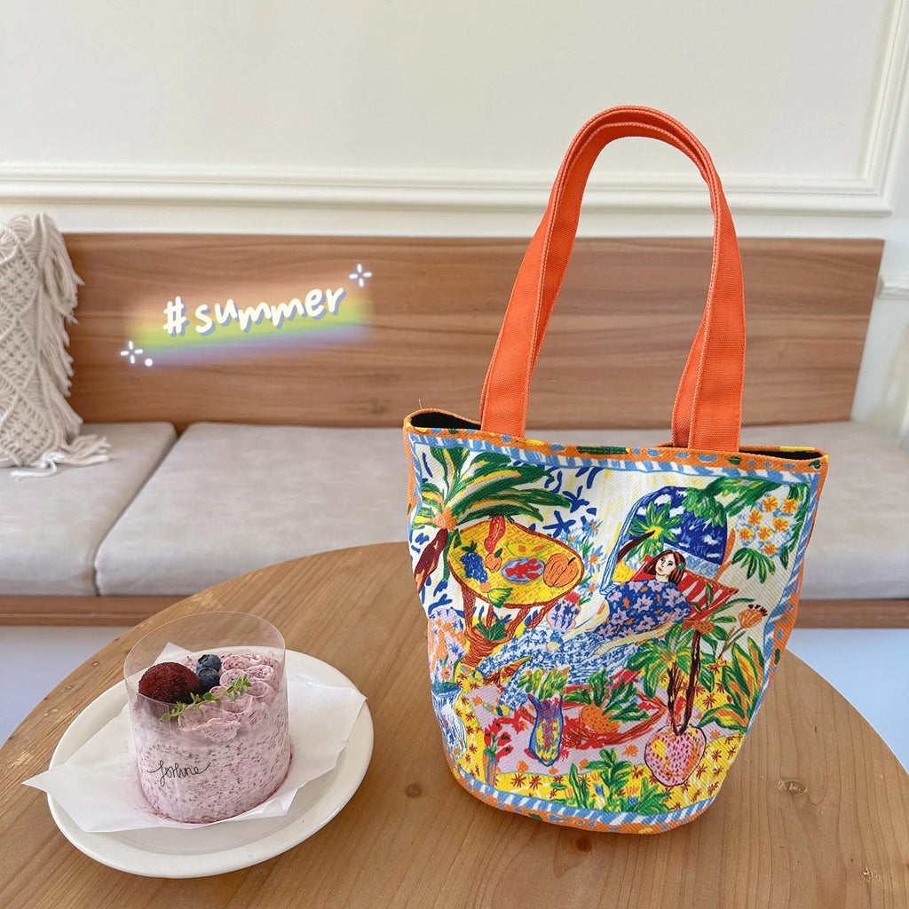 Orange canvas bucket handbag with double shoulder straps and printed letter design