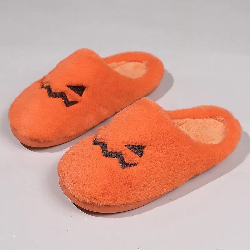 Orange pumpkin-shaped plush slippers with coral velvet upper on a non-slip PVC sole