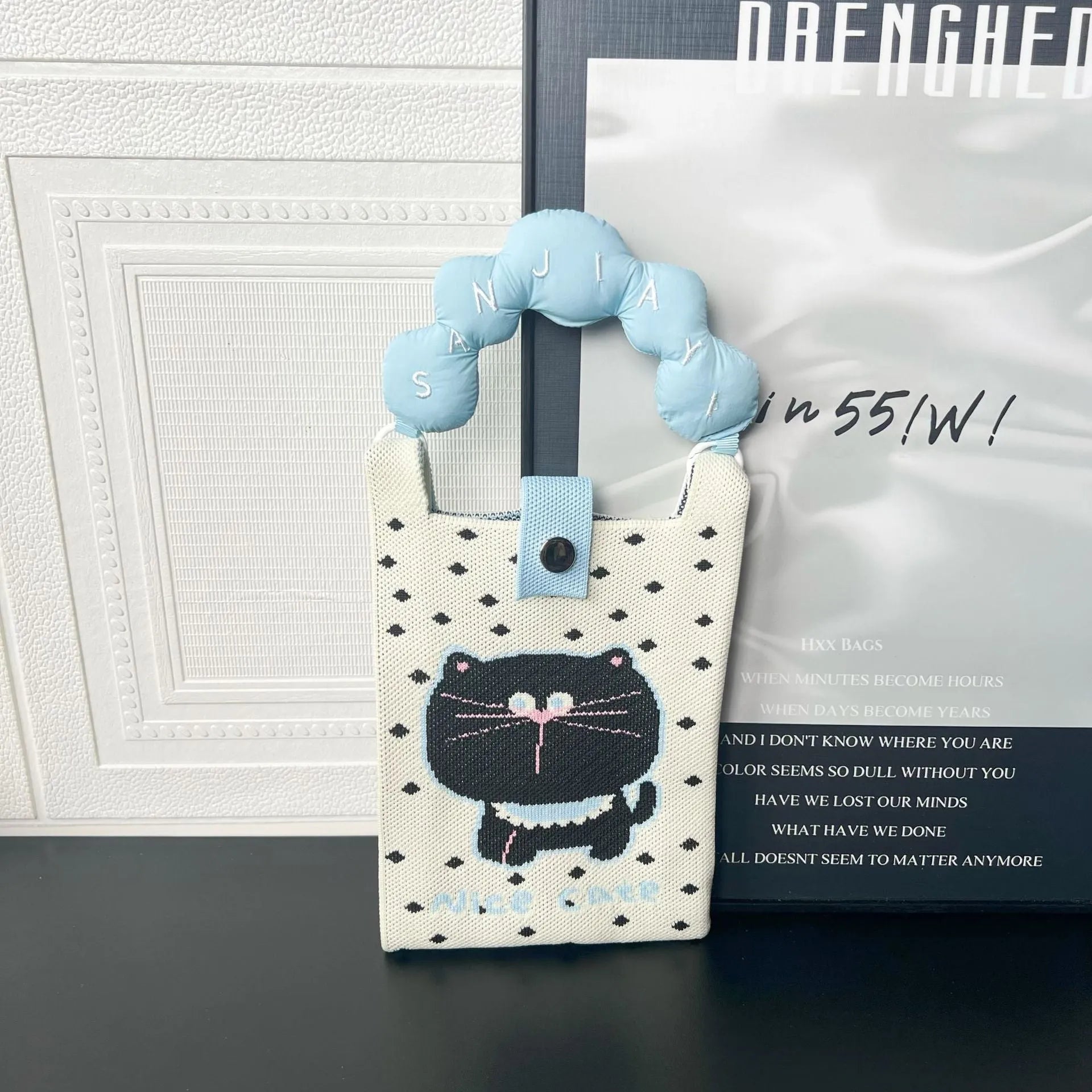 Cartoon knitted messenger bag with woven design and single shoulder strap