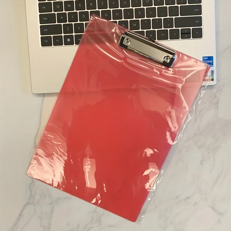 Clear plastic A4 plate holder with metal clip showing document inside, available in blue, green, red and white colours