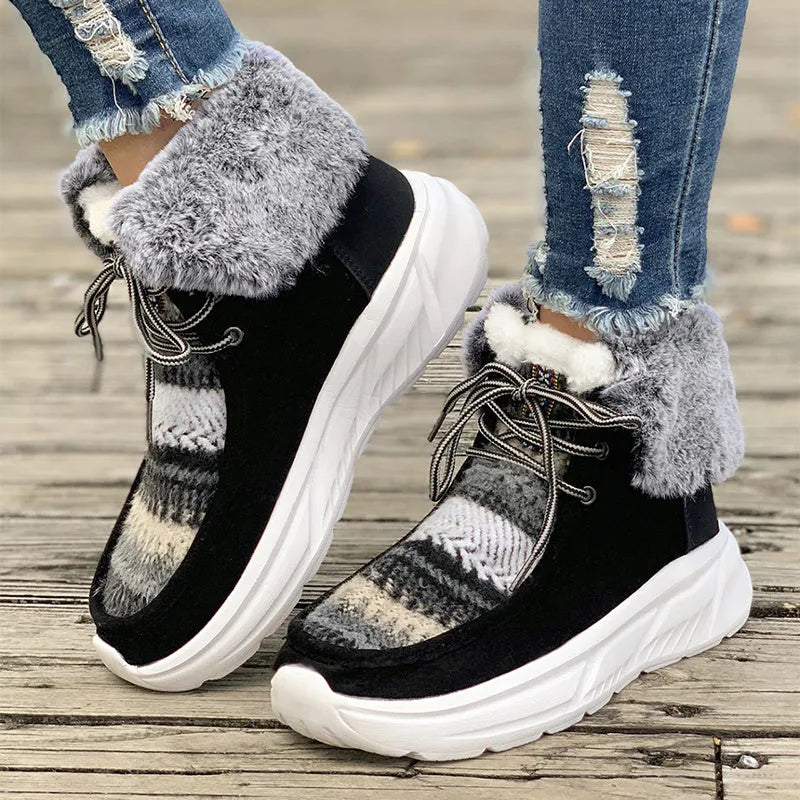 Beige women's lace-up suede snow boots with a thick platform sole and fur lining.