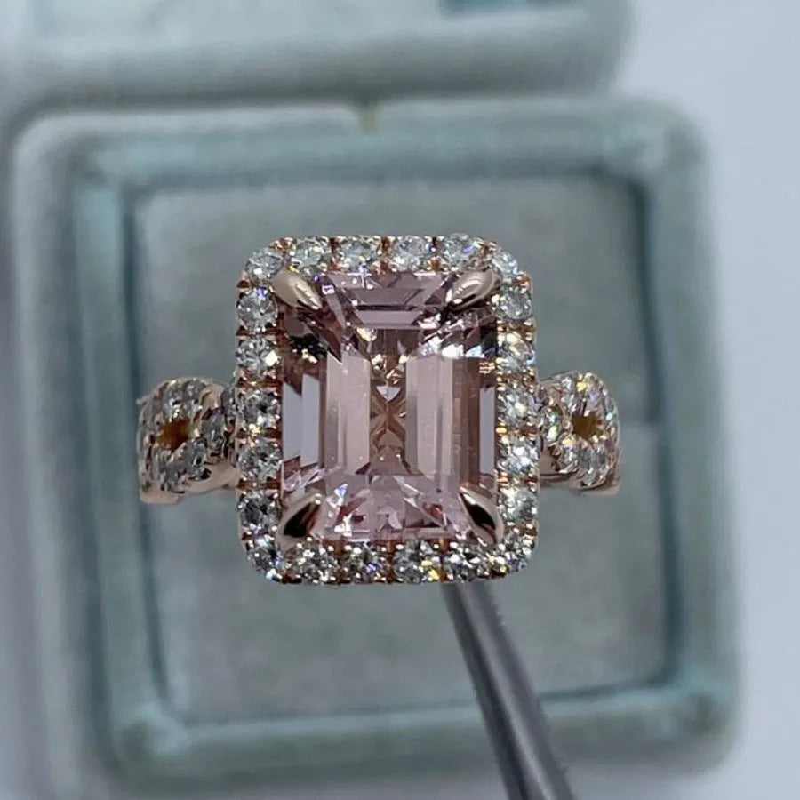 Rose gold coloured geometric alloy ring showing electroplated finish and angular design details
