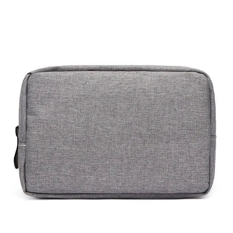 Multi-purpose polyester buggy bag for digital accessories and travel items, shown in gray handbag style