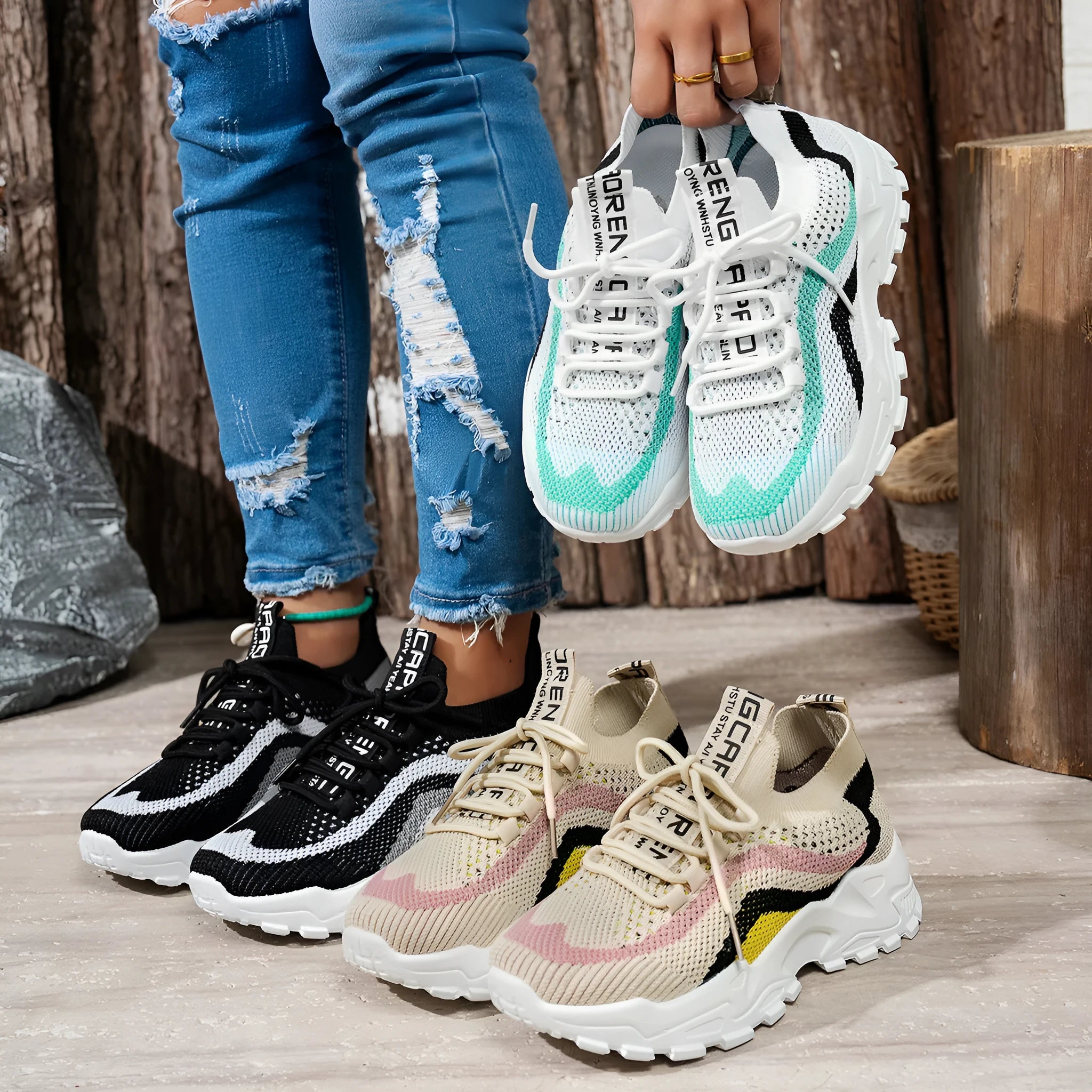 Women's black and white casual sports shoes with mesh upper and lace-up front.