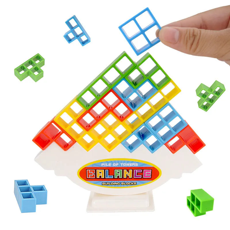 Plastic balance stacking board game with 16 coloured blocks, chassis, and base on a 26.5cm square box.