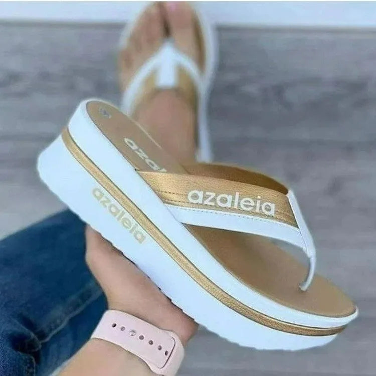 Women's solid colour PU platform summer slippers with a herringbone toe holder design.