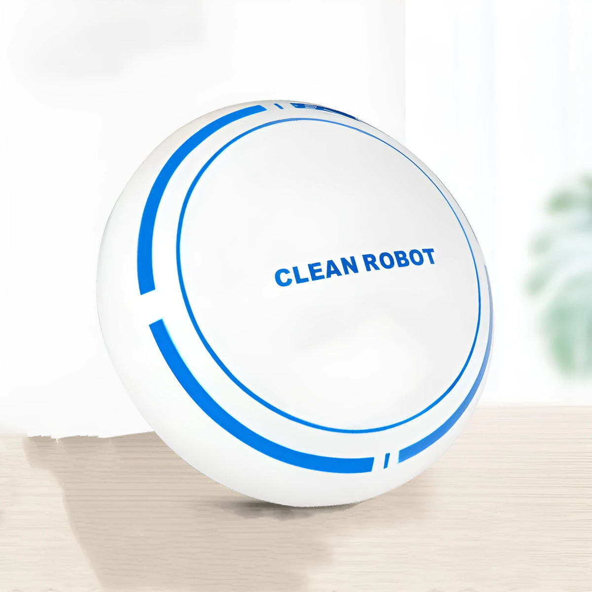 Mini desktop robot vacuum cleaner in white or black with dry dust box, flat nozzle and 4 metre power cord.
