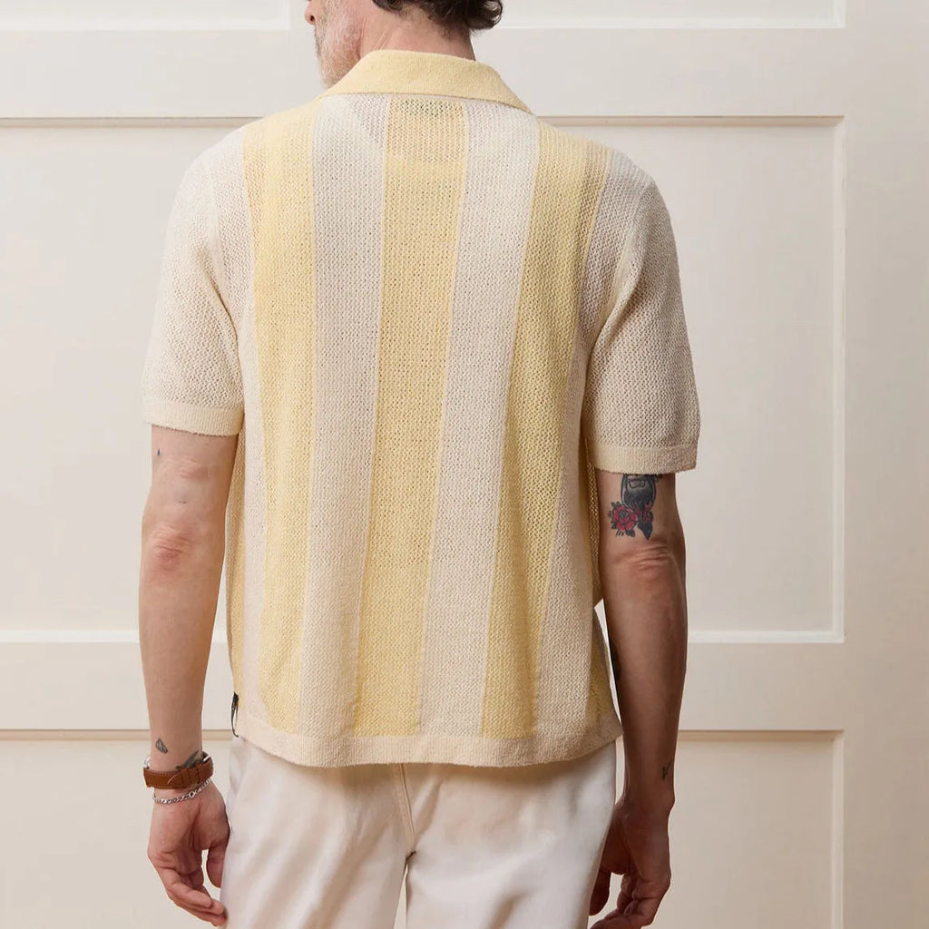 Yellow casual polo shirt with hollow-out design and asymmetric cut, short sleeves, made from Tencel fabric.