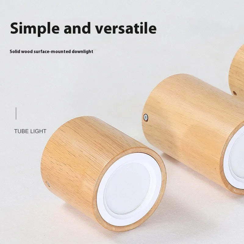 Modern solid wood surface mounted downlight in wood colour, shown in round and square shapes.