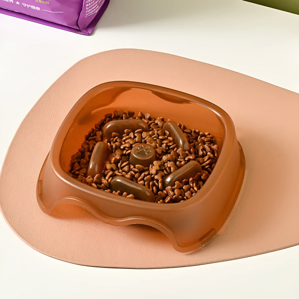Blue plastic slow feeder dog bowl with internal ridges to prevent choking.