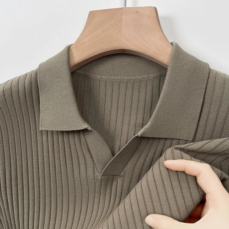 Man wearing a grey mulberry silk short-sleeved T-shirt with a lapel collar.