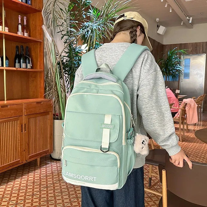 Waterproof nylon school backpack with curved shoulder straps in multiple colour options