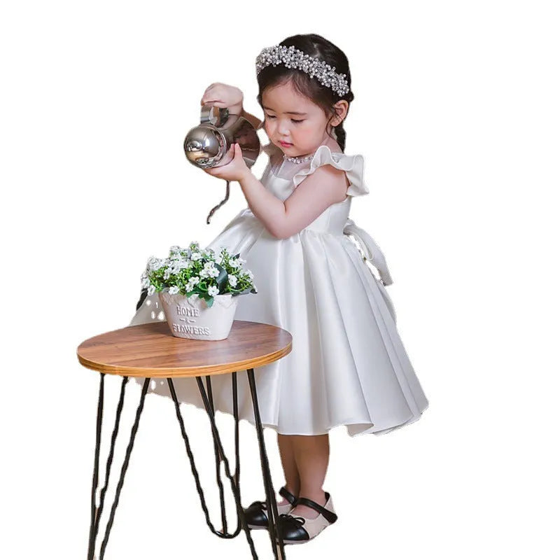 White satin princess dress for girls with puff sleeves, chemical fibre fabric, and flax lining on a white background