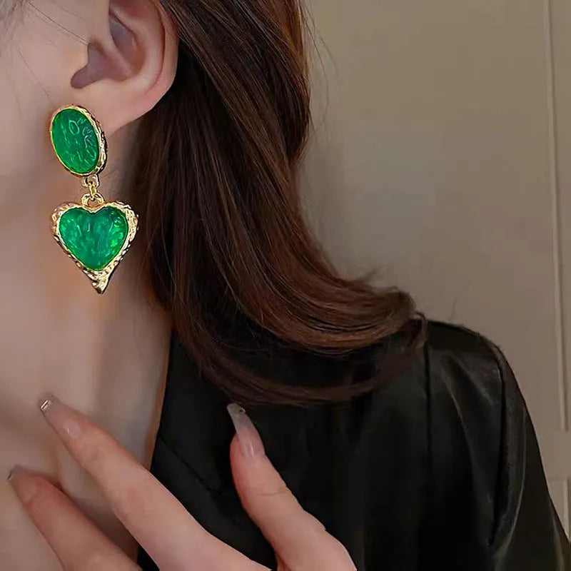 Silver needle pleated oval love heart stud earrings in purple, red, green, and yellow white colour options.