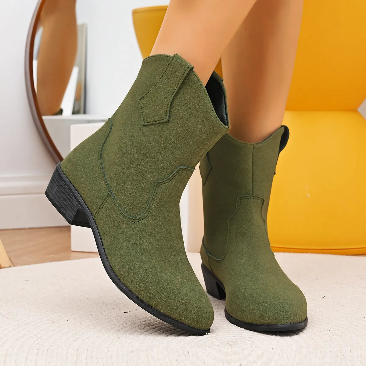 Pointed British style mid heel boots in black PU upper with rubber sole