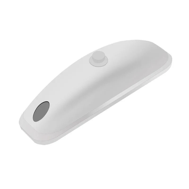 White vehicle-mounted remote pilot lamp laser with USB cable and remote control on a surface