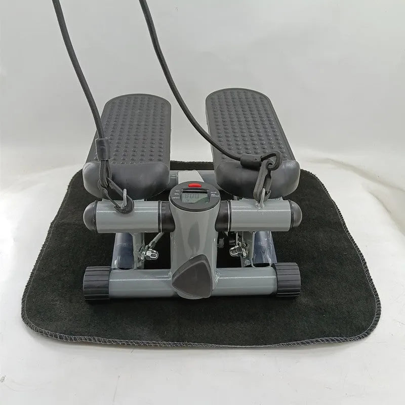Silver grey hydraulic mini treadmill waist slimming pedal exercise machine for home use.