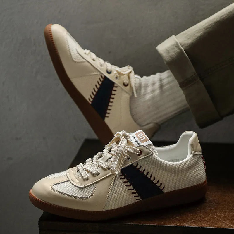 White mesh men's fashion casual exercise sneakers with flat heel on display