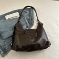 Large capacity PU leather single shoulder bag in black with internal mobile phone pocket