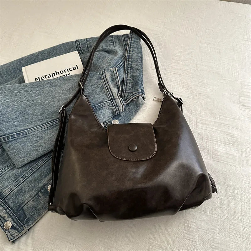 Large capacity PU leather single shoulder bag in black with internal mobile phone pocket