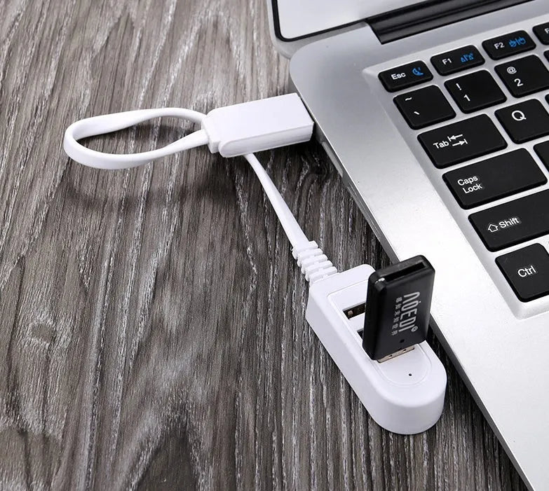 Cable separator hub with 3 USB ports and Micro USB interface on a desk