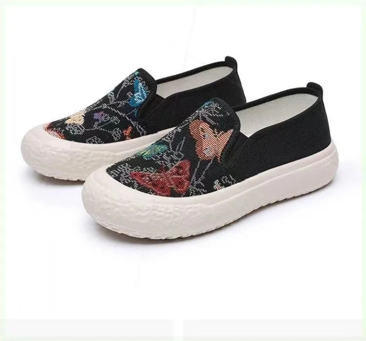 Women's canvas slip-on shoes with plastic injection-moulded sole and decorative sewing thread details