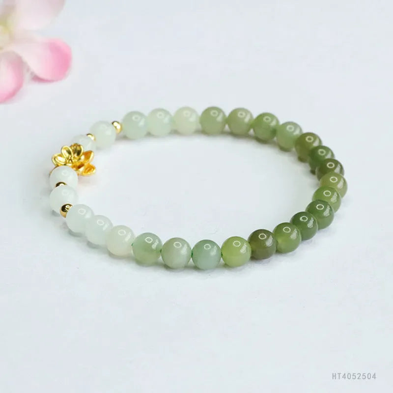 Ancient style jade bracelet with clear water gradient colour and lotus flower design