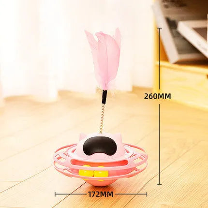 Pink rotating cat tumbler toy measuring 17 by 10 centimetres on a flat surface