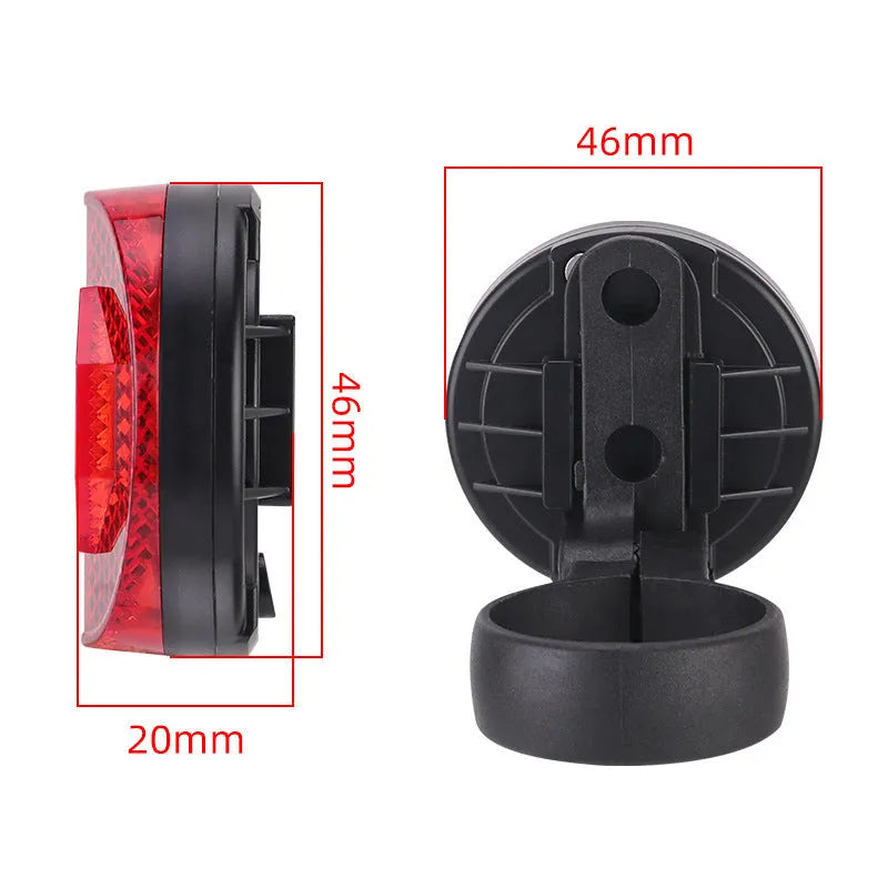 Red plastic anti-theft bicycle taillight bracket mounted on a bike seat post.