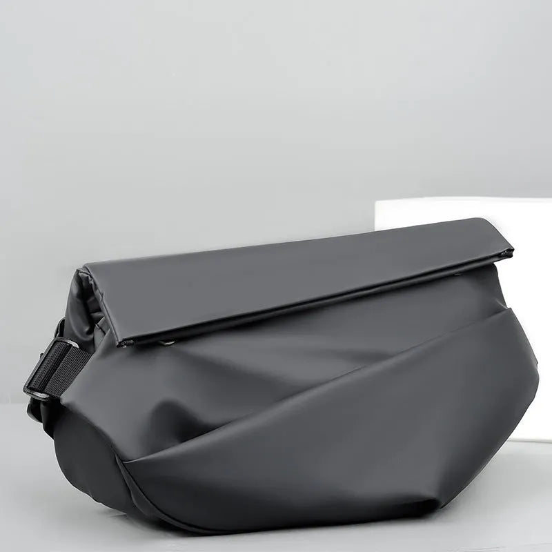 Grey PU leather crossbody bag for men showing front zipper and adjustable shoulder strap