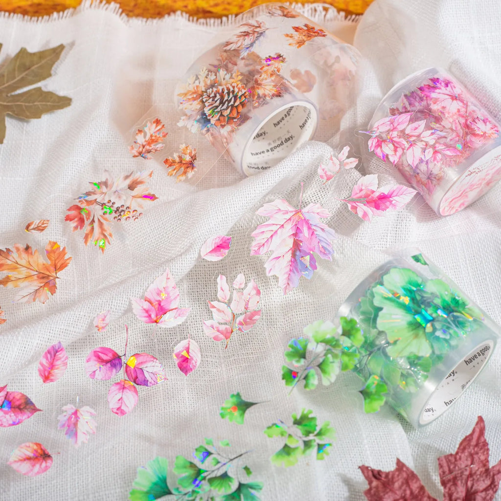 Roll of 40mm wide decorative PET stickers showing six leaf and nature designs including ginkgo and maple motifs.