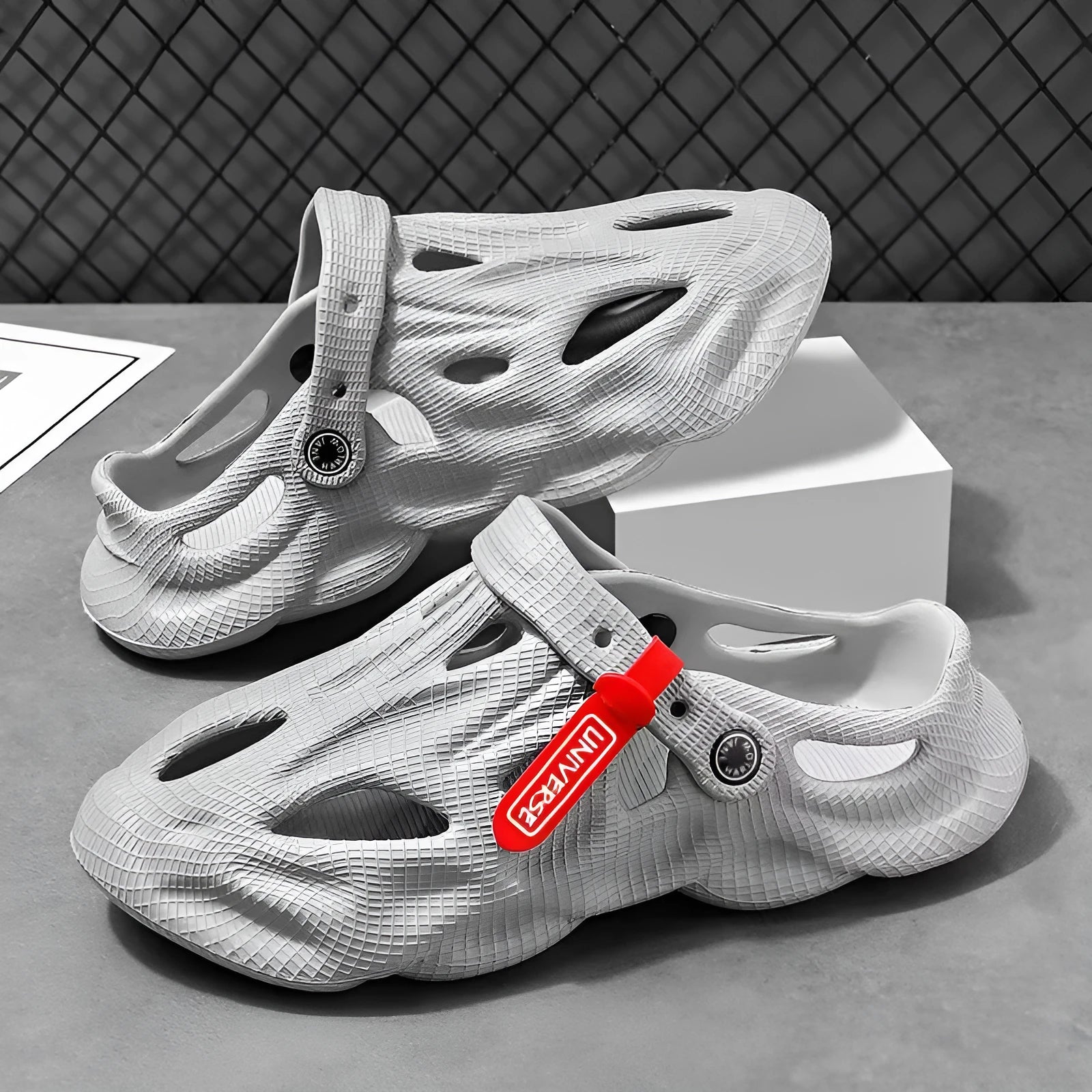 Coconut slippers in EVA foam with closed toe design and textured surface in grey colour