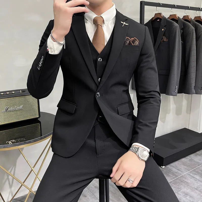 Three-piece men's acetate fibre blend business suit set in light gray with jacket, trousers, and vest.