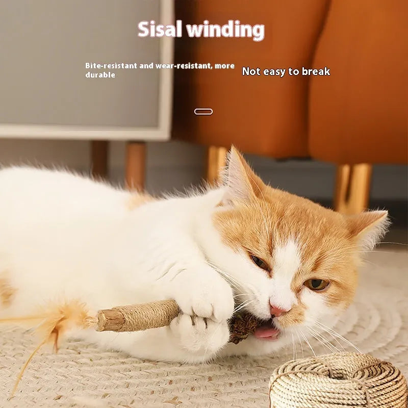 Wooden cat teeth grinding rod with catnip stem and raffia decoration, 2.2cm thick.