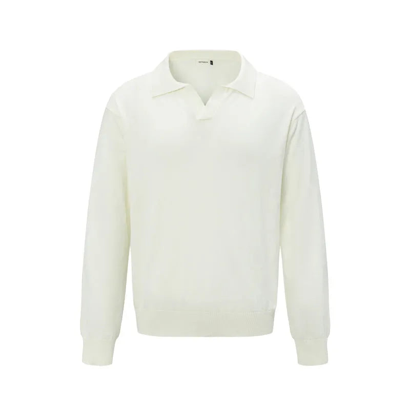 Loose beige pullover sweater on a hanger, front view.