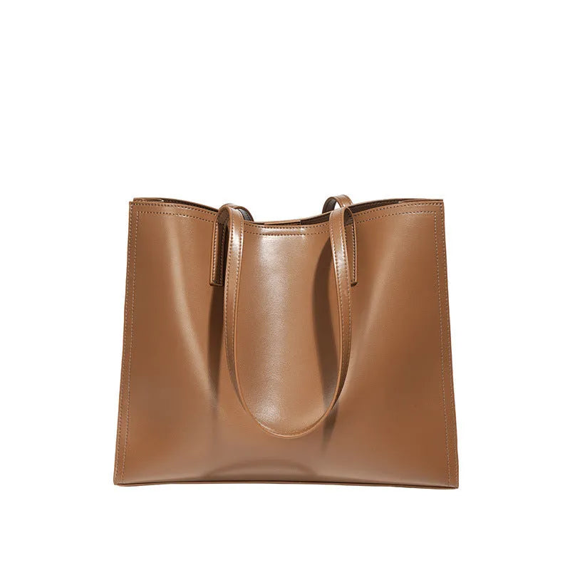 Women's brown genuine leather one shoulder handbag with horizontal square shape showing interior organisation compartments