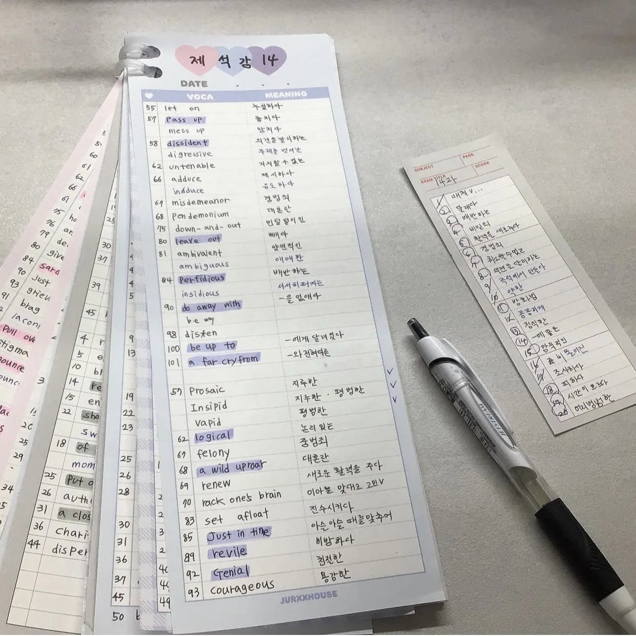 Vertical half-B5 notepad with printed lines for English words, in blue cover.