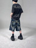 Men's blue denim shorts with frayed five-pointed star detailing and loose fit design