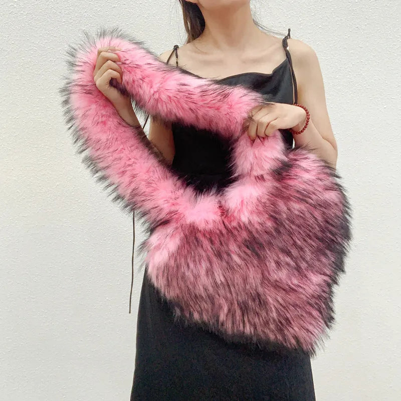 Women winter fleece heart shape crossbody bag with plush exterior, tassel detail, and large capacity