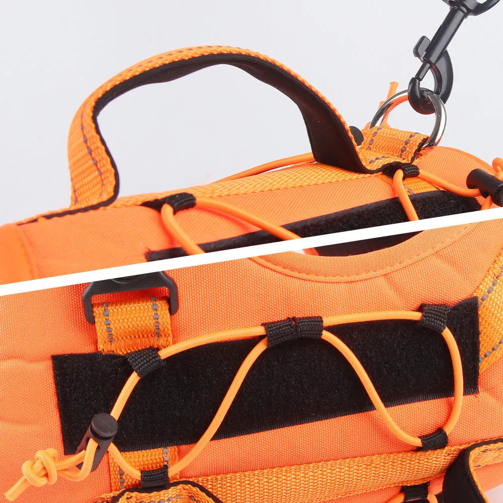 Orange reflective dog vest harness with a black detachable hand-holding rope laid flat.