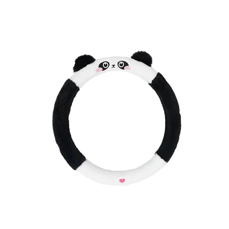 Plush faux fur steering wheel cover with embroidered cartoon bear face, fitted on a car steering wheel