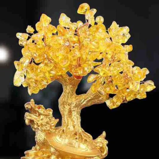 Citrine resin turtle money tree Feng Shui ornament on a white background.